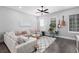 Cozy living room with hardwood floors, large windows, and comfortable seating at 250 Castleberry Station Sw Dr, Atlanta, GA 30313
