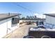 Spacious rooftop deck with city views, string lights, and outdoor seating areas at 250 Castleberry Station Sw Dr, Atlanta, GA 30313