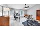 A spacious bedroom with a ceiling fan, drumset and office setup at 2682 Arbor Glen Pl., Marietta, GA 30066