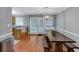 Dining area with a modern light fixture and a view into the kitchen at 2682 Arbor Glen Pl., Marietta, GA 30066