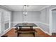 Well-lit dining area with rustic table and bench seating at 2682 Arbor Glen Pl., Marietta, GA 30066