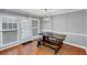 Dining area with farmhouse dining set, chandelier, and large windows at 2682 Arbor Glen Pl., Marietta, GA 30066