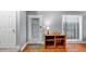 Bright entryway featuring hardwood floors, a storage cabinet, and a storm door at 2682 Arbor Glen Pl., Marietta, GA 30066