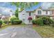 Two-story townhome featuring a well-maintained front yard and paved driveway at 2682 Arbor Glen Pl., Marietta, GA 30066