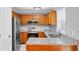 A kitchen with stainless steel appliances, granite countertops, and wood cabinets at 2682 Arbor Glen Pl., Marietta, GA 30066