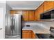 A kitchen with stainless steel appliances, wood cabinets, and granite countertops at 2682 Arbor Glen Pl., Marietta, GA 30066