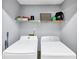 A laundry room with a shelf and two washing machines at 2682 Arbor Glen Pl., Marietta, GA 30066