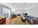 Comfortable living room featuring a fireplace, plush seating, and natural light from windows at 2682 Arbor Glen Pl., Marietta, GA 30066