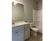 Well-lit bathroom featuring a shower, a white vanity, and a neutral color scheme at 3708 Cheswolde Ave, Powder Springs, GA 30127