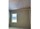 A bedroom with a window, carpet, and white trim throughout the room at 3708 Cheswolde Ave, Powder Springs, GA 30127