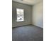 Bedroom features include carpeted floors and a view from the single window at 3708 Cheswolde Ave, Powder Springs, GA 30127