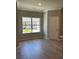 Cozy dining area with wood-look floors and a large window at 3708 Cheswolde Ave, Powder Springs, GA 30127