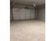Spacious garage with an overhead door at 3708 Cheswolde Ave, Powder Springs, GA 30127