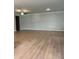Expansive living room with light wood flooring and ample natural light at 3708 Cheswolde Ave, Powder Springs, GA 30127