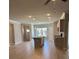Open-concept living space including kitchen and living room at 3708 Cheswolde Ave, Powder Springs, GA 30127