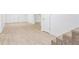 Spacious basement area with light-colored flooring, stairs with carpet, and ample room for customization at 4148 Kings Cswy, Ellenwood, GA 30294