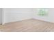 Unfinished basement space, featuring light-colored floors and a window for natural light at 4148 Kings Cswy, Ellenwood, GA 30294