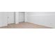 Unfinished basement area with light-colored flooring, neutral walls, and a white door with trim at 4148 Kings Cswy, Ellenwood, GA 30294