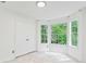 Sunlit bedroom featuring large windows offering backyard views and a spacious closet at 4148 Kings Cswy, Ellenwood, GA 30294