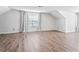 Bright and airy bedroom with neutral walls and laminate wood flooring at 4148 Kings Cswy, Ellenwood, GA 30294
