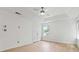Bright bedroom with neutral walls, light-colored flooring, a ceiling fan, and a large window at 4148 Kings Cswy, Ellenwood, GA 30294