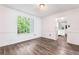Dining room features hardwood floors, neutral paint, decorative molding and a large window for natural light at 4148 Kings Cswy, Ellenwood, GA 30294