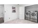 Functional laundry room featuring washer and dryer hookups, with ample space for storage at 4148 Kings Cswy, Ellenwood, GA 30294