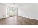 Bright living room features hardwood floors, large windows, and neutral paint, creating a welcoming space at 4148 Kings Cswy, Ellenwood, GA 30294