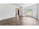Bright living room features hardwood floors, large windows, and neutral paint, creating a welcoming space at 4148 Kings Cswy, Ellenwood, GA 30294