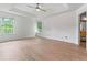 Expansive primary bedroom boasting tray ceilings, neutral walls, and ample natural light from two large windows at 4148 Kings Cswy, Ellenwood, GA 30294