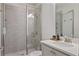 Modern bathroom features tile shower with glass doors, and white vanity sink with faucet at 820 Kenway Ave, Roswell, GA 30076