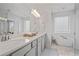Stylish bathroom with double sinks, soaking tub, and modern finishes creating a luxurious experience at 820 Kenway Ave, Roswell, GA 30076