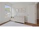 Charming Bedroom featuring a light-colored wooden dresser and views to the neighborhood at 820 Kenway Ave, Roswell, GA 30076