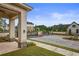 Elegant gated community entrance featuring brick pillars and well-manicured landscaping at 820 Kenway Ave, Roswell, GA 30076