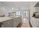 Beautiful open-concept kitchen flowing into a living area with natural light and neutral tones at 820 Kenway Ave, Roswell, GA 30076