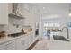 Gourmet kitchen with quartz countertops, stainless steel appliances, and modern backsplash at 820 Kenway Ave, Roswell, GA 30076