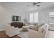 Bright living room with hardwood floors, plush seating, and natural light, creating a comfortable atmosphere at 820 Kenway Ave, Roswell, GA 30076