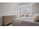 Comfortable bedroom featuring a large dresser, soft carpet, and serene atmosphere, ideal for relaxation at 820 Kenway Ave, Roswell, GA 30076