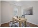 Bright office space with wooden desk, modern art, and view of the neighborhood at 820 Kenway Ave, Roswell, GA 30076