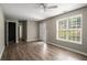 Cozy living room with a large window, light brown flooring, and a freshly painted neutral color at 175 Hearth Way, Fairburn, GA 30213