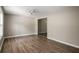 Bright living room featuring new light brown flooring and neutral paint, freshly renovated at 175 Hearth Way, Fairburn, GA 30213