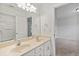 Bright bathroom with double vanity, large mirror, walk in shower, and white trim; connects to bedroom at 3366 Bridge Walk Dr, Lawrenceville, GA 30044