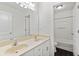 Bright bathroom features a double sink vanity with white cabinets and a full bath at 3366 Bridge Walk Dr, Lawrenceville, GA 30044