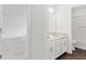 Well-lit bathroom includes double sinks and a full bath with seamless access to the bedroom at 3366 Bridge Walk Dr, Lawrenceville, GA 30044