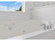 Close up of the tub with sleek chrome faucets at 3366 Bridge Walk Dr, Lawrenceville, GA 30044