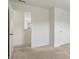 Bright bedroom with carpeted floors, white trim, and a doorway to the exterior at 3366 Bridge Walk Dr, Lawrenceville, GA 30044