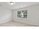 This bedroom is well lit and includes a large window with neighborhood views at 3366 Bridge Walk Dr, Lawrenceville, GA 30044