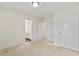 Neutral bedroom with white trim, carpeted floors, two closets, and bathroom ensuite at 3366 Bridge Walk Dr, Lawrenceville, GA 30044