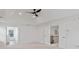 Bedroom featuring a modern ceiling fan, staircase, and view of nature at 3366 Bridge Walk Dr, Lawrenceville, GA 30044