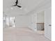 Spacious bedroom with a modern ceiling fan and a door leading to the staircase at 3366 Bridge Walk Dr, Lawrenceville, GA 30044
